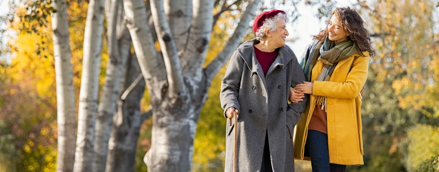 Life Assure Woman With Grandmother Walking In Autumn Park Blog